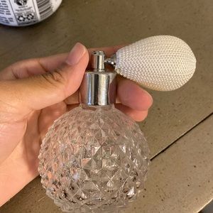 Perfume pump style bottle